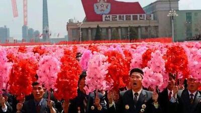 North Koreans react to Kim Jong-un's speech after a military parade marks 100 years since the birth of the country's founder and Jong-un's grandfather, Kim Il-sung, in Pyongyang.