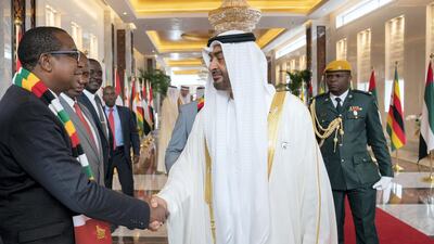 Sheikh Mohamed bin Zayed, Crown Prince of Abu Dhabi and Deputy Supreme Commander of the UAE Armed Forces (R), greets a member of the delegation accompanying Emmerson Mnangagwa, President of Zimbabwe (not shown), during a reception at the Presidential Airport. Ryan Carter for the Ministry of Presidential Affairs