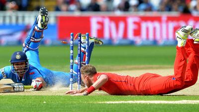 There was a brief period when the sun was out. It was also when Shikhar Dhawan, left, the highest run-scorer in the tournament nearly got run out by England's Stuart Broad. Andrew Yates / AFP