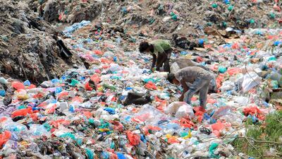Youths collect recyclable items at a rubbish dump in the Red Sea port city of Hodeidah, Yemen. AFP