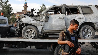 Armed Afghan security forces secure the site of a car bomb attack targeting a convoy of ministry of interior affairs advisors in Kabul, Afghanistan. EPA