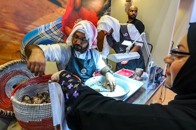 Bahrain's pearl-shucking display at Arabian Travel Market. Victor Besa / The National