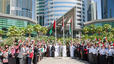 Ahmed Bin Sulayem, Executive Chairman, DMCC and Chief Executive Officer, DMCC, Gautam Sashittal, together with DMCC employees raised the UAE Flag outside Almas Tower at 12 noon today.