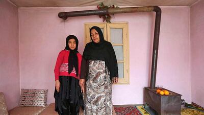 Noor Zia, 40, with her daughter Saba Ahmadi, 11, at their home in Kabul. Noor, who is a teacher, studied until she was 28. Her ambition was to become a doctor, but she couldn't afford the fees. She hopes her daughter will become a well-known, highly skilled doctor. Saba wants to go to university, and would like to become a renowned lawyer. Omar Sobhani / Reuters