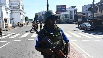 A member of the security personnel stands guard outside St. Anthony's Shrine in Colombo a day after the church was hit in a series of bomb blasts targeting churches and luxury hotels in Sri Lanka. AFP