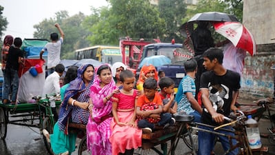 Bangladeshi women and children ride on a rickshaw in Dhaka, Bangladesh, 23 August 2019. EPA