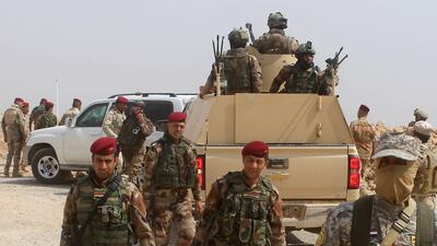 Iraqi forces backed by paramilitary units advancing on Anah, one of ISIL's last bastions in the vast western Iraqi province of Anbar bordering Syria, on September 19, 2017. Moadh Al Dulaimi / AFP