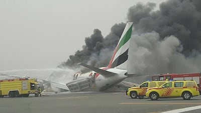 Emergency crews arrived quickly after the Emirates plane crash landed at Dubai International Airport but one firefighter died in the incident. Photo: Twitter