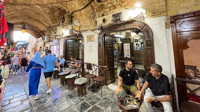 Patrons relax at the Zitouna cafe near the landmark Zitouna Mosque at the heart of the medina in Tunis. Ghaya Ben Mbarek / The National