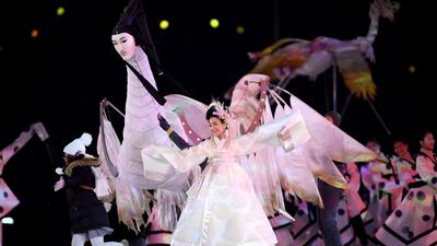 Performers entertain the crowd during the opening ceremony. Matthias Hangst / Getty Images