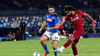 Napoli's Kostas Manolas and Liverpool's Mohamed Salah in action. EPA