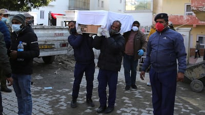 Health workers carry the coffin of a victim killed in a stampede at the Mata Vaishno Devi shrine, at a hospital in Katra, India. The stampede at the Hindu shrine in Indian-controlled Kashmir killed at least 12 people and injured 13 others on New Year’s Day, officials said. AP Photo