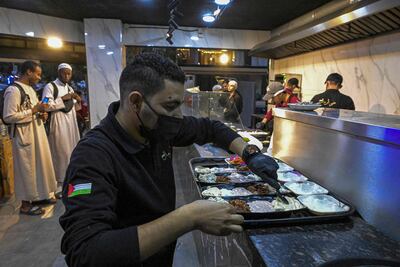 After fleeing with his family to Egypt from Gaza, Palestinian Bassem Abu Aoun opened an eatery in Cairo's Nasr City neighbourhood. AFP