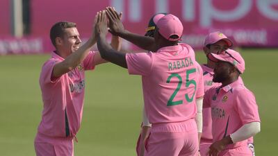 South Africa's Anrich Nortje, left, celebrates with teammates after the dismissal of Pakistan's Danish Aziz at the Wanderers Stadium in Johannesburg. AFP