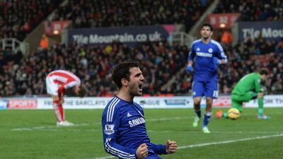 Chelsea’s Spanish midfielder Cesc Fabregas celebrates scoring their second goal during the English Premier League football match between Stoke City and Chelsea at the Britannia Stadium in Stoke-on-Trent, central England, on December 22, 2014. Chelsea won the game 2-0. AFP PHOTO / OLI SCARFF