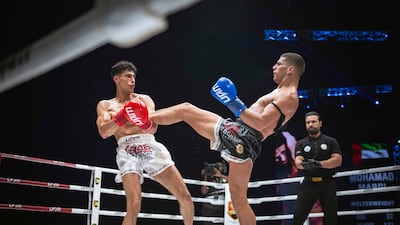 Mohammed Mardi, in black trunks, won the welterweight title at the inaugural Arab Muaythai Fight Night. Photo: UAEMKFED
