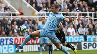 Edin Dzeko had 16 goals in 23 Premier League matches for Manchester City in 2013/14. Ian MacNicol / AFP