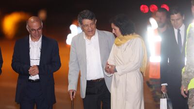 From left, Austrian-Iranians Kamran Ghaderi and Massud Mossaheb, former hostages in Iran, are greeted by Belgium's Foreign Minister Hadja Lahbib in Brussels on June 2. EPA