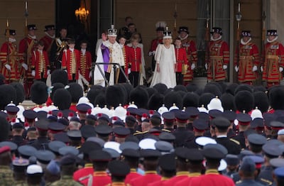 King Charles III and Queen Camilla receive the royal salute from gathered military personnel on the West Terrace of the Buckingham Palace gardens. Getty Images