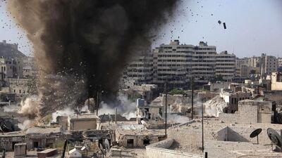 Smoke billows following the detonation of explosives placed by Syrian government forces inside a tunnel that was reportedly used by rebels in the government-controlled section of Aleppo. George Ourfalian / AFP