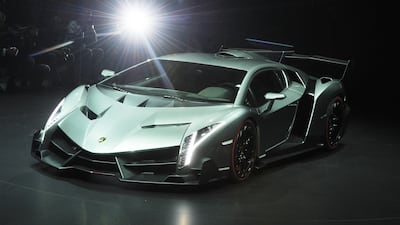 epa03609786 The Lamborghini Veneno is introduced by Volkswagen on the eve of the first press day of the 83rd Geneva International Motor Show, in Geneva, Switzerland, 04 March 2013. The Geneva International Motor Show will open its doors to the public from March 7-17, 2013 at PALEXPO in Geneva. EPA/ULI DECK *** Local Caption *** 03609786.jpg