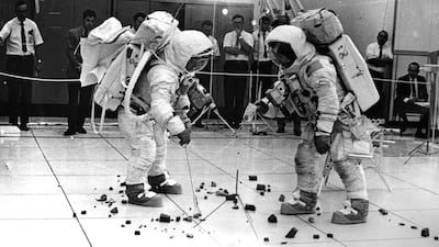 Apollo XII astronauts Charles 'Pete' Conrad Jnr and Albert Bean practise collecting rock samples at the Kennedy Space Centre in preparation for their lunar landing mission in 1969