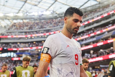 Team captain Mehdi Taremi walks off during the half-time break against New Zealand. EPA
