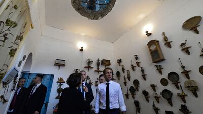 French President Emmanual Macron listens to a guide as he visits the Bytna Institution for Culture, Heritage and Arts, in Iraq's second city of Mosul. AFP