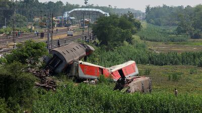 Damaged coaches at the site of a train collision following the accident in Balasore district in Odisha. Reuters