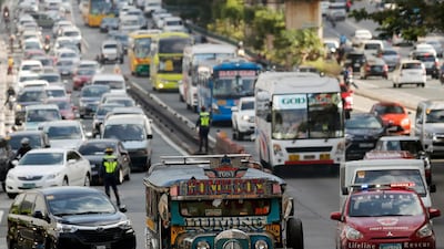 A jeepney, a popular and uniquely Filipino mode of mass transport, amid heavy traffic in Manila. A planned new city is hoped to ease congestion in the Philippines capital. Francis R Malasig/EPA