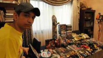 Kuwaiti youngster Yousef Mujeen displays his WWF memorabilia collection at his home of Jabriya, Kuwait.
