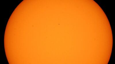 View of the transit of the planet Mercury, which is observed tiny (black dot above), in front of the Sun, from the Lunaria planetarium in the city of Guadalajara, Jalisco state, Mexico. EPA