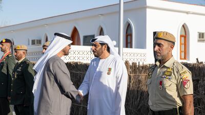 President Sheikh Mohamed with members of the UAE Armed Forces at the unification ceremony at Abu Mreikhah
