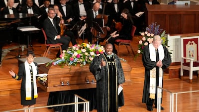 Pastor Tony Lowden, centre, says a prayer during a tribute service for former first lady Rosalynn Carter at Glenn Memorial Church at Emory University in Atlanta, Georgia. AP