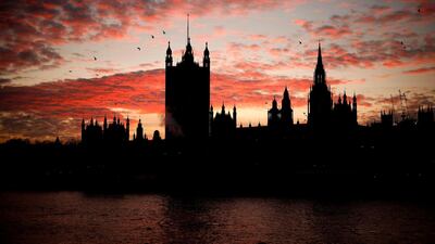 The sun sets behind the Victoria Tower at the Palace of Westminster, home to the Houses of Parliament, in London. AFP