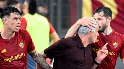 Roma manager Jose Mourinho celebrates with Matias Vina, right, after Stephan El Shaarawy's late winner against Sassuolo. AFP
