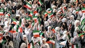 Pupils gather at Fajr Al Sabah School as they prepare to attend in-person classes after a two-month suspension due to the Iran war. AFP