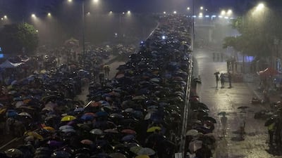 Protesters waved their cellphones with bright LED flashlights sparkling in the dark. Paula Bronstein/Getty Images