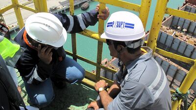 Workers direct the operation of a crane at a massive drydock and ship repair facility in Oman’s Duqm Special Economic Zone. Analysts say that although 44 per cent of Omani graduates have studied engineering, many fail to get jobs in the sector. Fatma Alarimi / Reuters / April 10, 2016