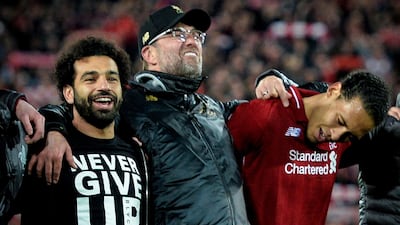 Mohamed Salah, left, with Jurgen Klopp, centre, and Virgil van Dijk celebrate Liverpool's 4-0 win over Barcelona which put them in the Uefa Champions League final. EPA