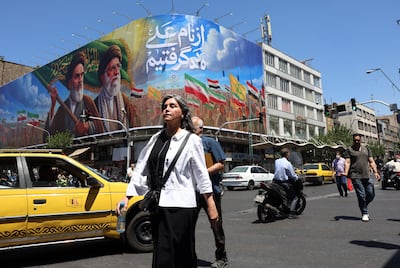 A poster showing late Iranian supreme leaders Ruhollah Khomeini and Ali Khamenei in Tehran. EPA