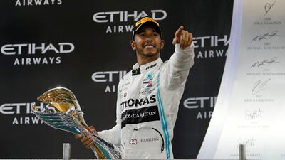 Lewis Hamilton celebrates after winning last season's Abu Dhabi GP. Reuters