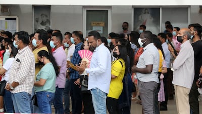 Worshippers outside during the Easter Sunday mass held at St Mary's. Pawan Singh / The National