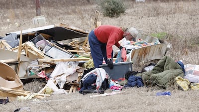 Scott Wayman sifts through the debris of his home in the aftermath of a tornado in the Autauga County community of Old Kingston in Prattville, Alabama. EPA