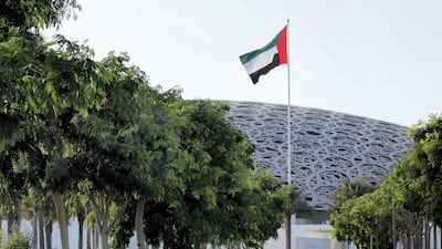 Abu Dhabi, United Arab Emirates, September 17, 2020. The U.A.E. flag proudly waves at the Louvre Abu Dhabi on a Thursday afternoon. Victor Besa/The National. Section: Standalone