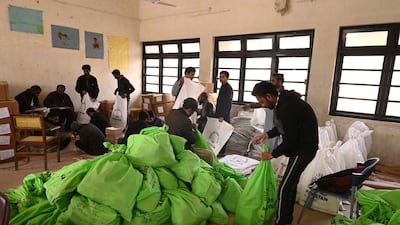 Workers prepare voting materials at a distribution centre in Hyderabad. (Photo by Akram SHAHID / AFP)