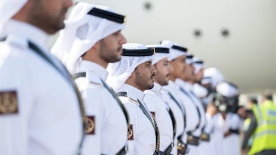 Members of the Qatari honour guard await the arrival of Sheikh Mohamed and his UAE delegation