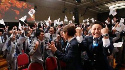 Members of the Japanese bid committee celebrate as Jacques Rogge, president of the International Olympic Committee announces Tokyo as the city to host the 2020 Summer Olympic Games.