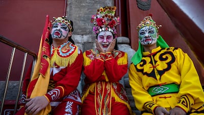 Chinese dancers wait to perform a Yingge folk dance, from southern China, at the Dongyue Temple in Beijing. Getty Images