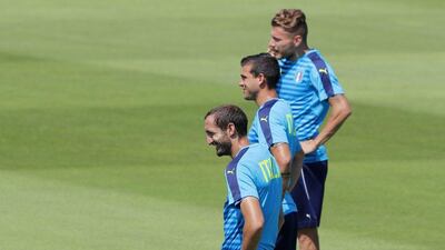 Italy’s Ciro Immobile, background, Giorgio Chiellini, foreground, and Stefano Sturaro attend a training session at the Bernard Gasset centre in Montpellier, France, Friday, July 1, 2016. Italy will face Germany in a Euro 2016 quarter-final match in Bordeaux on Saturday, July 2, 2016. Antonio Calanni / AP Photo